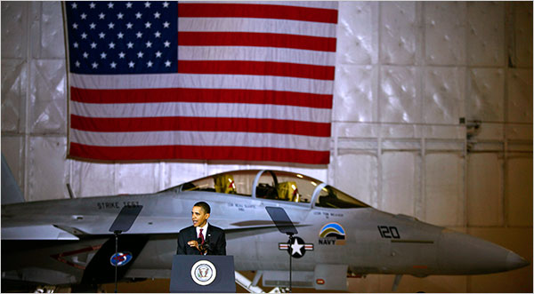 Luke Sharrett/The New York Times - President Obama, with an F-18 â€œGreen Hornetâ€ that will run partly on bio fuel, during his speech on energy security on Wednesday at Andrews Air Force Base in Maryland. 