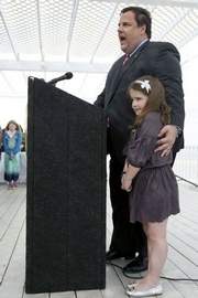 With his daughter Bridget at his side, Gov. Chris Christie announced at the Surfrider Beach Club in Sea Bright on Thursday that he is opposed to offshore drilling. (PHOTO: BRADLEY J. PENNER)
