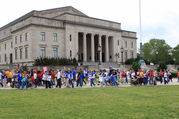 Protestors walk by War Memorial on way to State House rally against Christie education cuts (May 22, 2010)