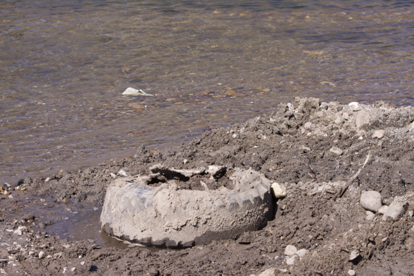 tire bulldozed right into the river