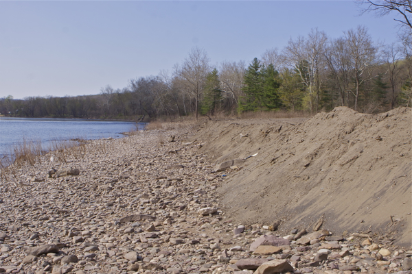 no erosion controls - heavy rain or rising river will wash this soil, fill, and debris right into the river